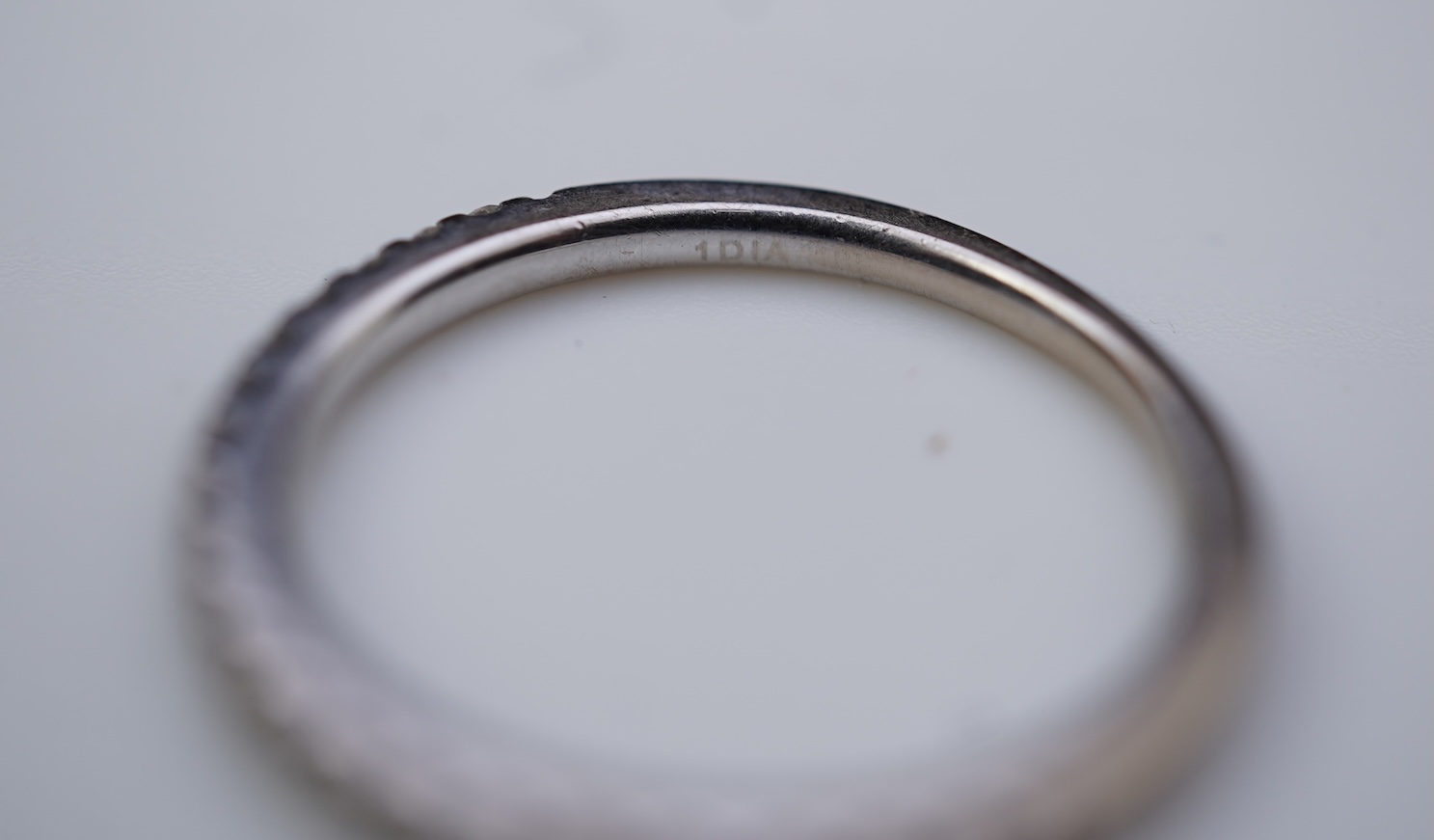 A diamond engagement ring and half eternity ring
